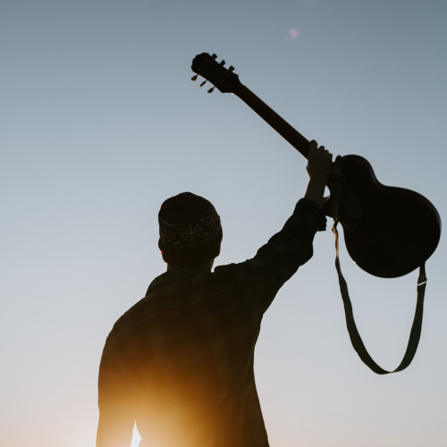A man holding a guitar