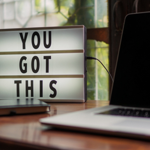 A motivational poster on a desk