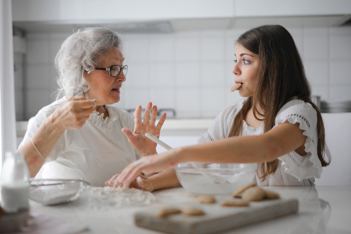 A woman baking cookies with her grandmother