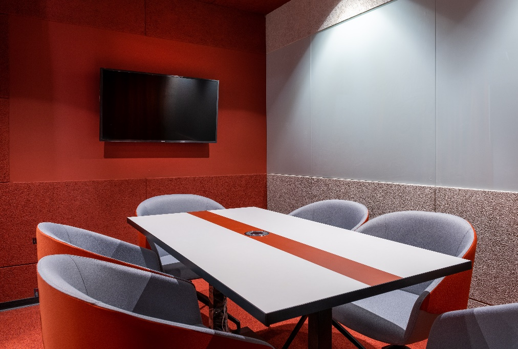 a modern conference room with a tv