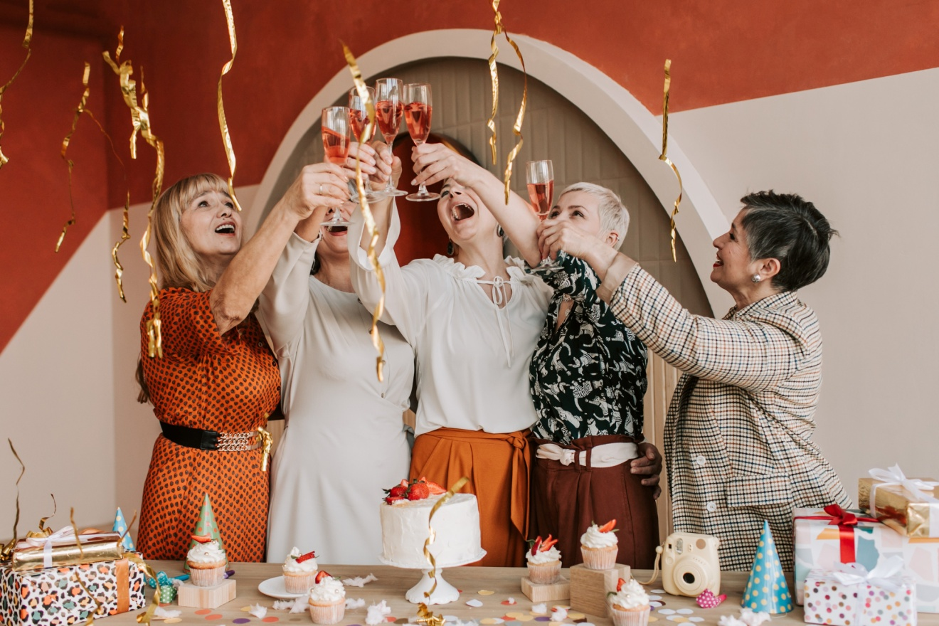 Women toasting to their friend